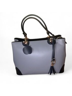 Black and grey purse with tassel